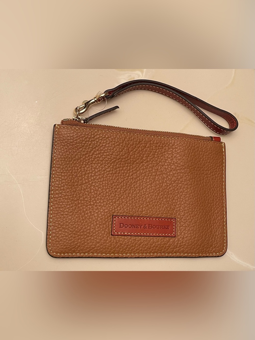 Dooney & Bourke Pebbled Leather Wristlet in Cognac Brown Brand New.